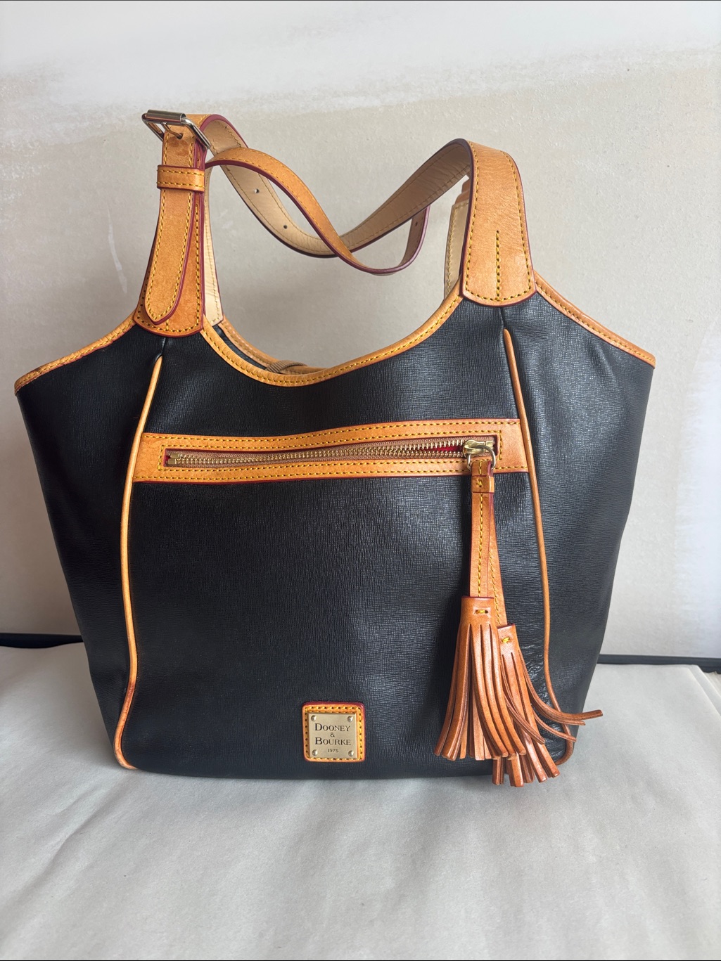 Dooney & Bourke Black And Tan Leather Tassel Tote